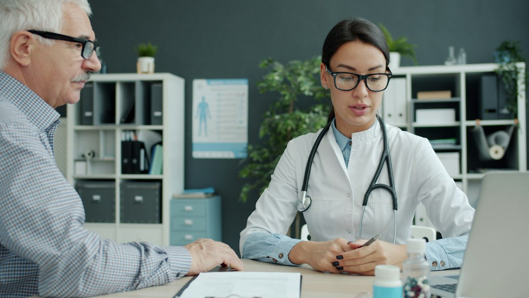 Healthcare professional consulting with an older adult patient