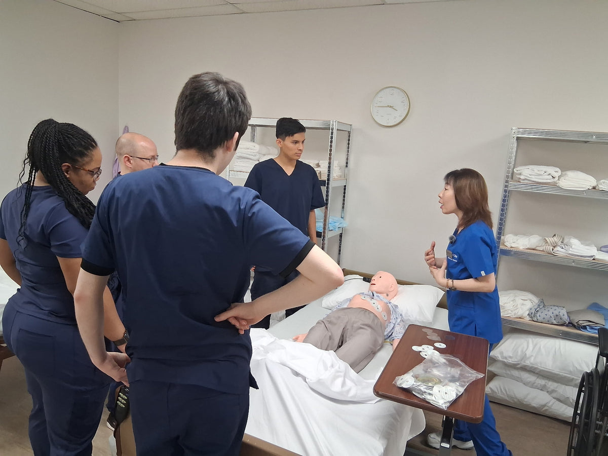 DMS students practicing bedside patient care in a skills lab
